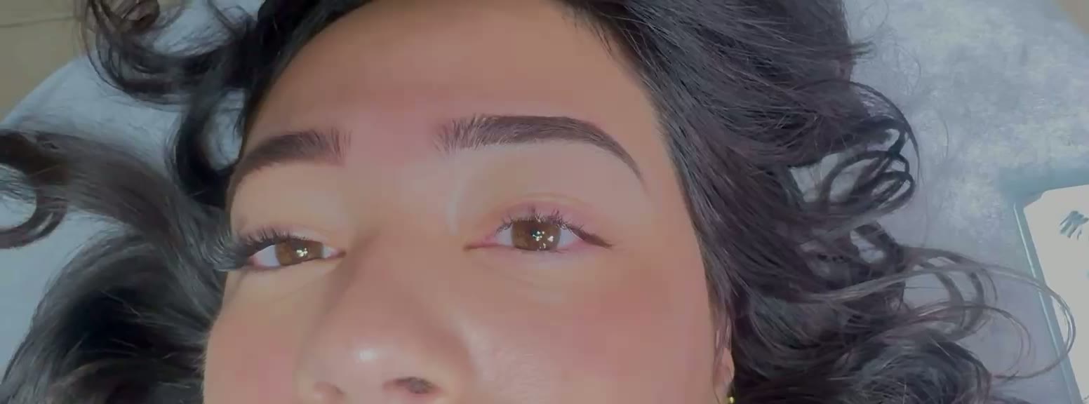 Close-up of freshly microshaded brows and classic lash extensions on a client at InstaBrows by Kyara